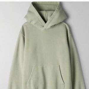 TNA cozy af sweater in saje green.